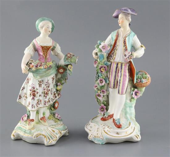 A pair of large Derby figures of flower sellers, c.1760, H. 26.5 and 24.5cm